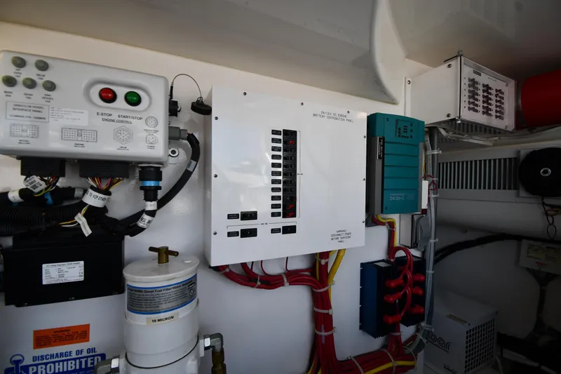 Slide: The Image of Engine control panel and wiring inside a 2012 Viking 42 Open boat. - 74
