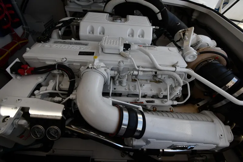 Slide: The Image of Engine compartment of a 2012 Viking 42 Open boat, showcasing detailed machinery. - 76