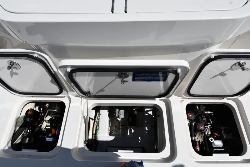 Slide: The Image of Engine compartment of a 2012 Viking 42 Open boat with open hatches. - 79