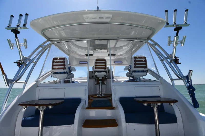 Slide: The Image of 2012 Viking 42 Open yacht interior with seating and fishing rod holders. - 8