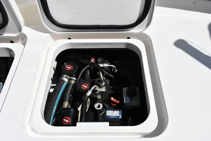 Slide: The Image of Engine compartment of a 2012 Viking 42 Open boat, showcasing mechanical components. - 80