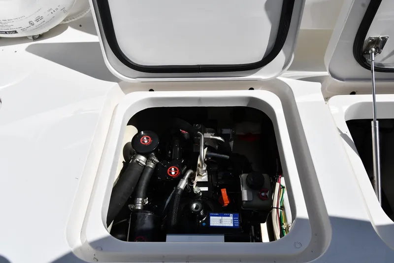 Slide: The Image of Engine compartment of a 2012 Viking 42 Open boat, showcasing mechanical components. - 81