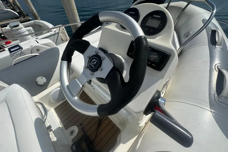 Slide: The Image of Steering console of a 2016 Zodiac 340 DL boat with Yamaha controls. - 10