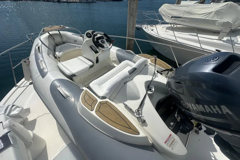Slide: The Image of 2016 Zodiac 340 DL inflatable boat with Yamaha engine, docked at marina. - 12
