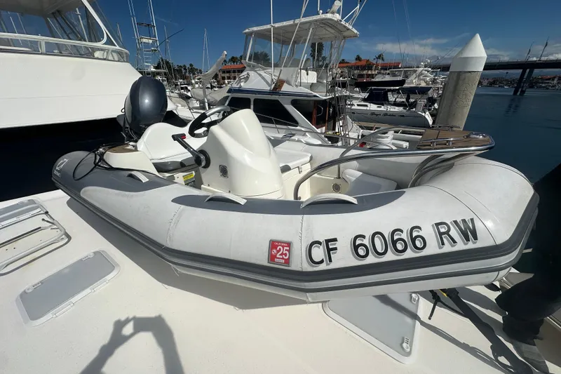 Slide: The Image of 2016 Zodiac 340 DL inflatable boat docked at a marina, registration CF 6066 RW. - 3