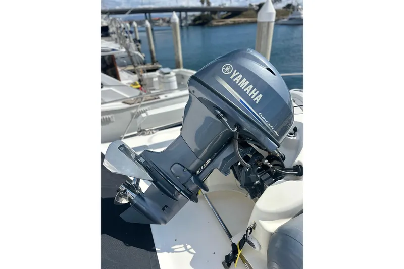 Slide: The Image of Yamaha outboard motor on 2016 Zodiac 340 DL boat at marina. - 6