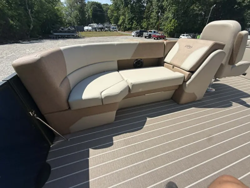 Slide: The Image of Interior of 2026 Manitou 230 Aurora with beige seating. - 4