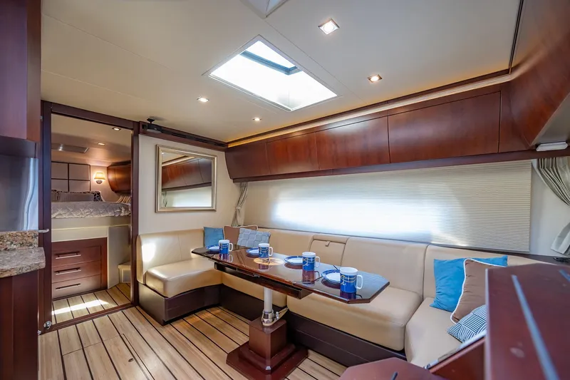 Slide: The Image of Luxurious interior of 2015 Regal 53 Sport Coupe yacht with elegant seating and dining area. - 13