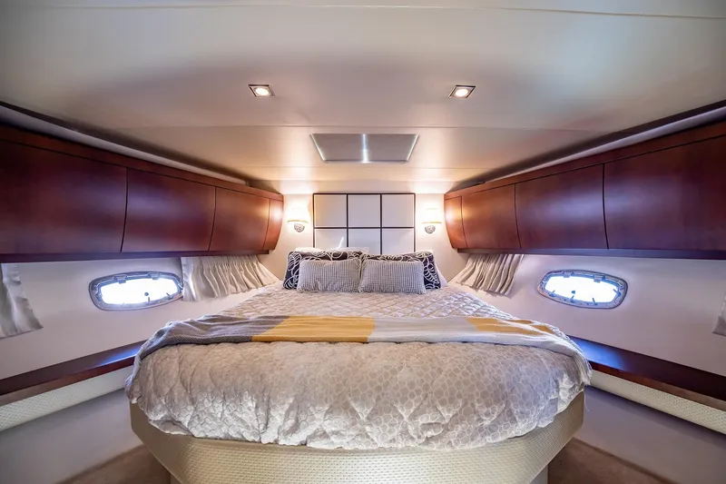 Slide: The Image of Luxurious bedroom interior of 2015 Regal 53 Sport Coupe yacht with elegant wood cabinetry. - 16