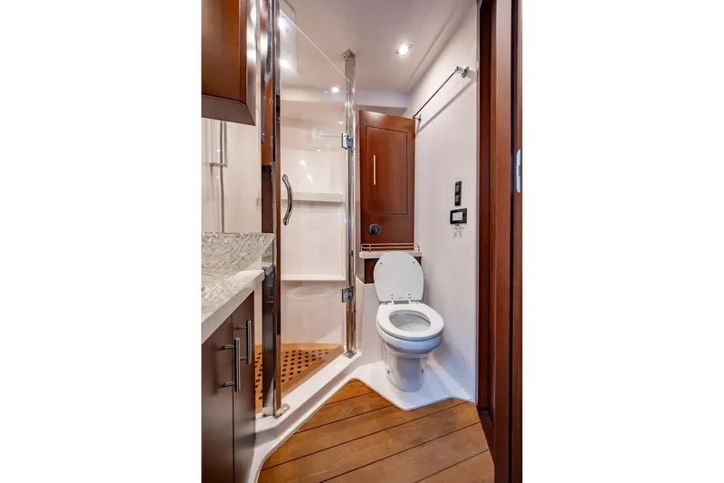 Slide: The Image of Luxurious bathroom in 2015 Regal 53 Sport Coupe yacht with modern fixtures. - 17