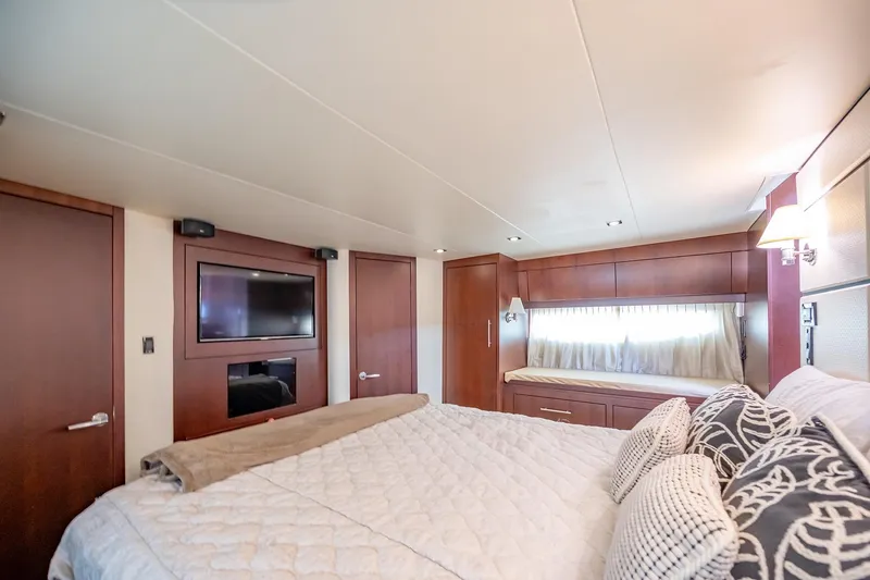 Slide: The Image of Luxurious bedroom interior of 2015 Regal 53 Sport Coupe yacht with elegant wood finishes. - 19