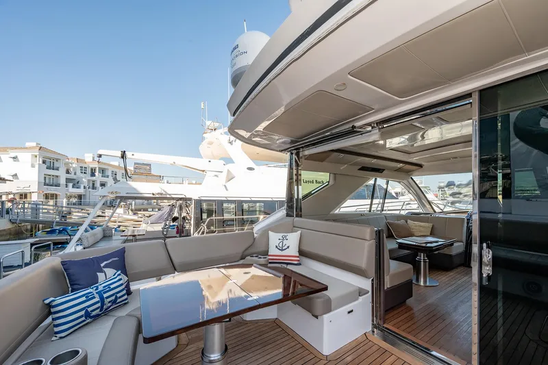 Slide: The Image of Luxurious 2015 Regal 53 Sport Coupe yacht with elegant seating and modern design. - 7