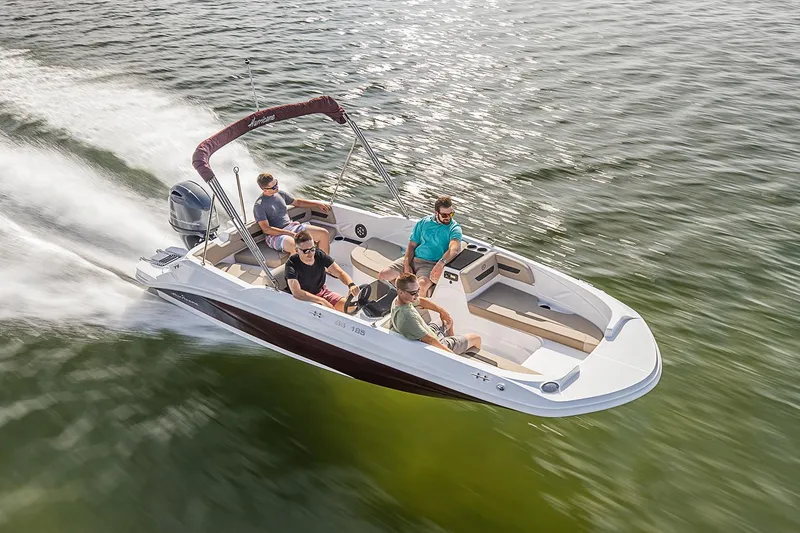 Slide: The Image of Manufacturer Provided Image: 2022 Hurricane SunDeck Sport 185 OB boat cruising on water with passengers. - 2