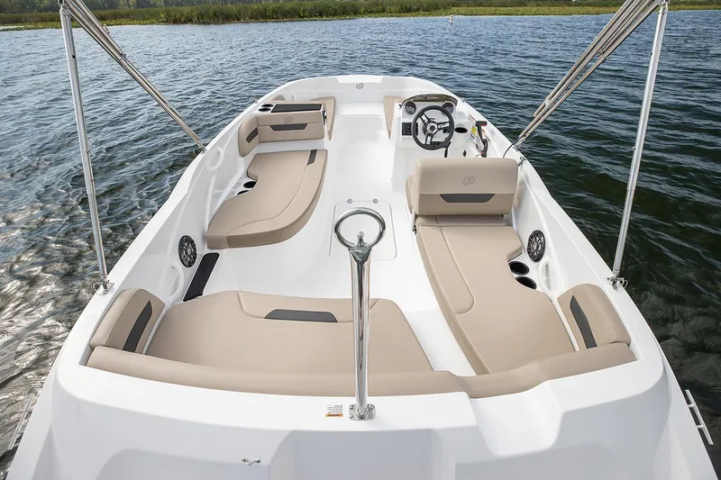 Slide: The Image of Manufacturer Provided Image: 2022 Hurricane SunDeck Sport 185 OB boat interior with beige seating on water. - 4