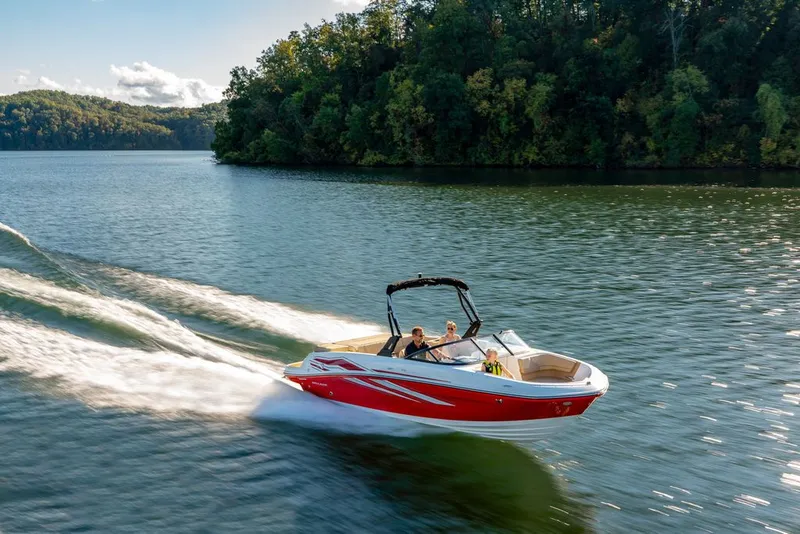 The Image of 2026 Bayliner VR6 Bowrider I/O cruising on a serene lake. - 1