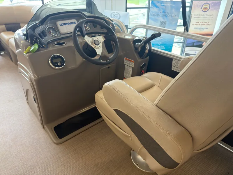 Slide: The Image of Interior of a 2020 Tracker 22DLX with steering console and seat. - 38