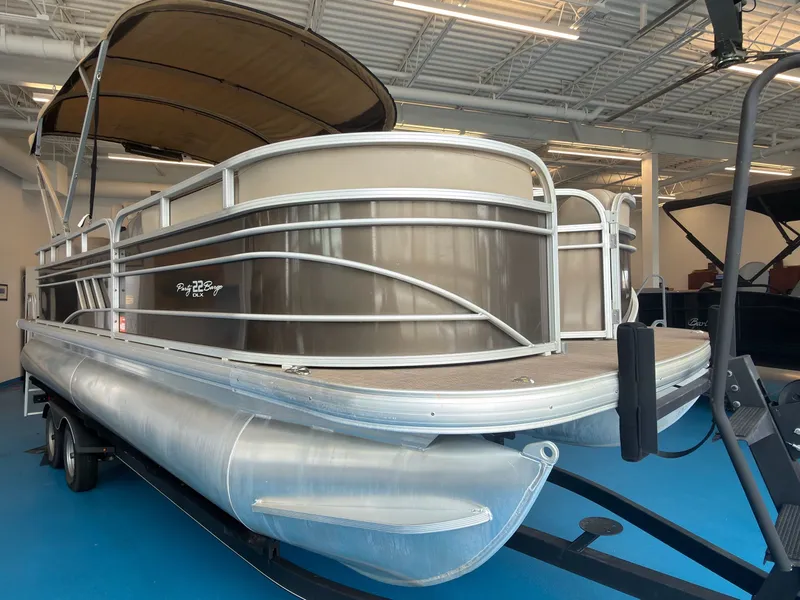 Slide: The Image of 2020 Tracker 22DLX pontoon boat in showroom. - 39