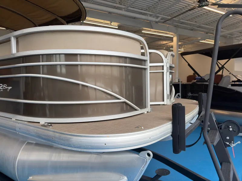 Slide: The Image of 2020 Tracker 22DLX pontoon boat in showroom. - 44