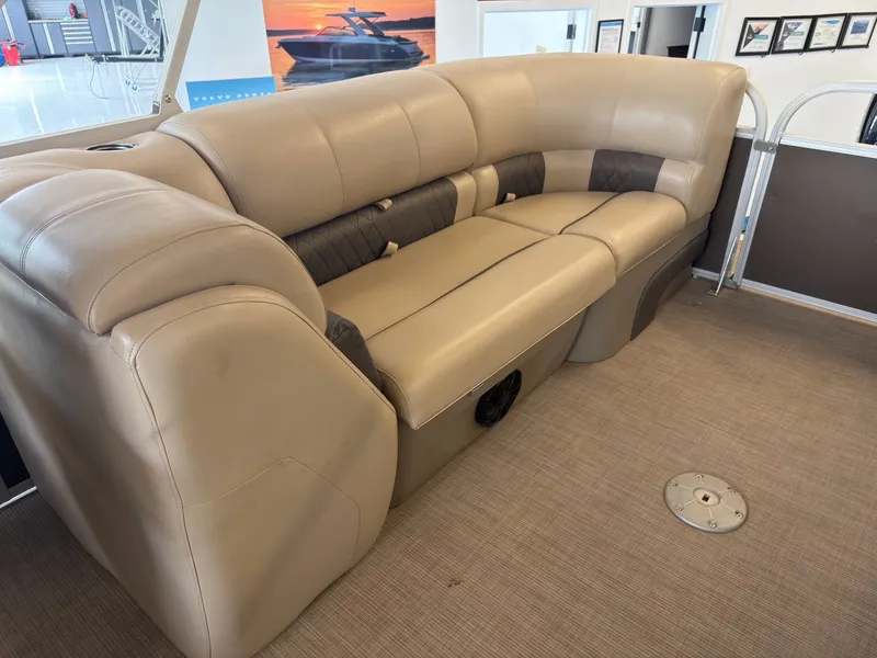 Slide: The Image of Interior of a 2020 Tracker 22DLX with beige leather seating. - 47