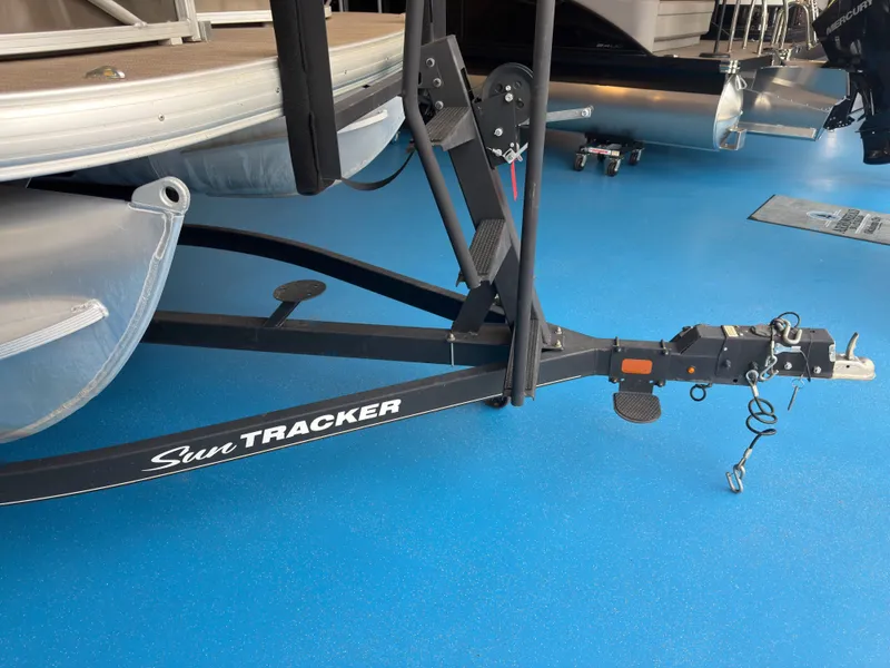 Slide: The Image of 2020 Tracker 22DLX boat trailer on blue floor. - 48
