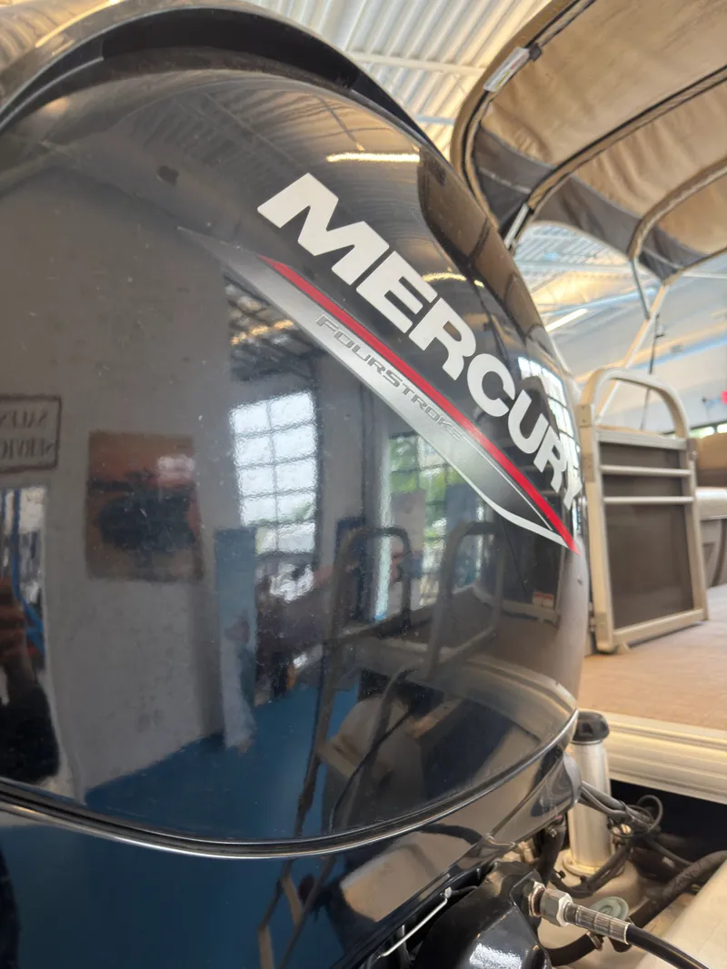 Slide: The Image of Mercury outboard motor on Tracker 22DLX boat, year 2020. - 49
