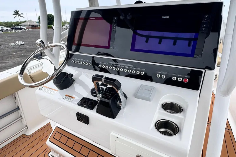 Slide: The Image of 2017 Sportsman Open 312 Center Console dashboard with steering wheel and navigation screens. - 15