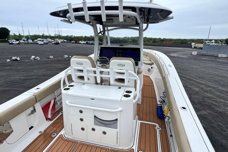 Slide: The Image of 2017 Sportsman Open 312 Center Console boat with spacious deck and modern helm. - 17