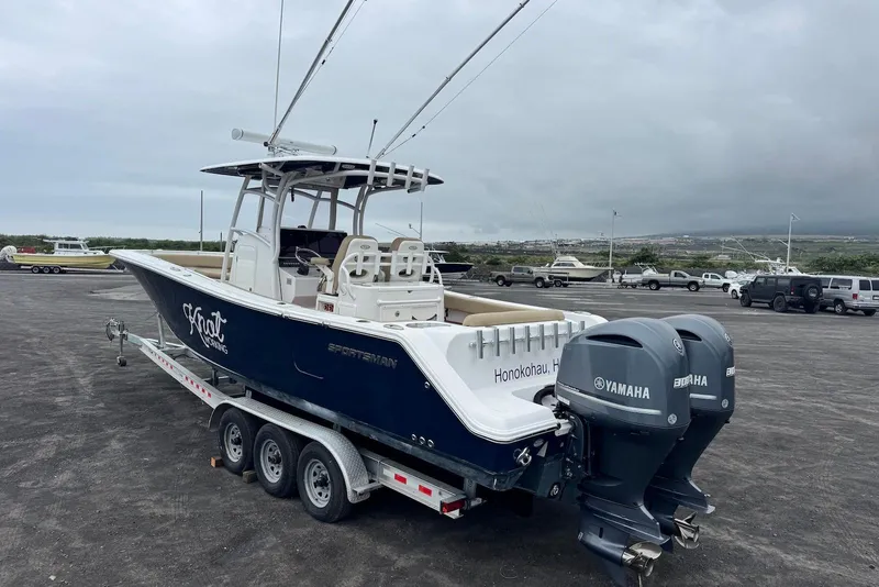 Slide: The Image of 2017 Sportsman Open 312 Center Console boat on trailer with twin Yamaha engines. - 3