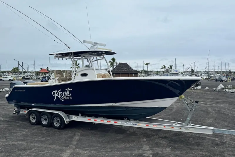 Slide: The Image of 2017 Sportsman Open 312 Center Console boat on trailer at marina. - 6
