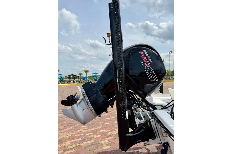 Slide: The Image of 2022 Blazer Bay 2200 boat with Mercury Pro XS outboard motor, parked on brick pavement. - 11