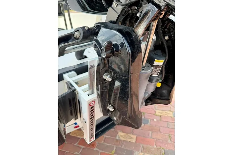 Slide: The Image of Close-up of 2022 Blazer Bay 2200 boat engine mount and hydraulic system. - 14