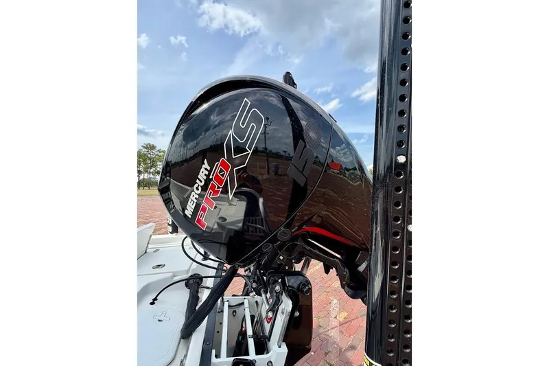 Slide: The Image of Mercury Pro XS engine on 2022 Blazer Bay 2200 boat under a clear sky. - 16