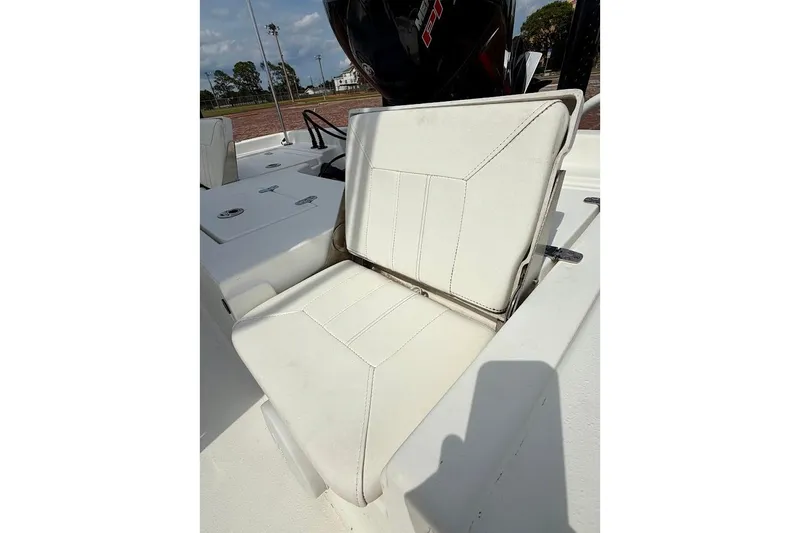 Slide: The Image of 2022 Blazer Bay 2200 boat seat with white upholstery and sleek design. - 17