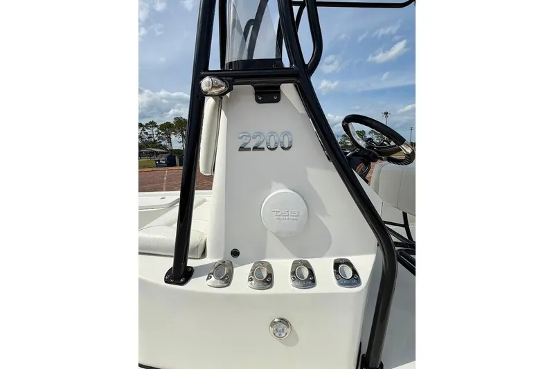 Slide: The Image of 2022 Blazer Bay 2200 boat console with steering wheel and controls. - 18