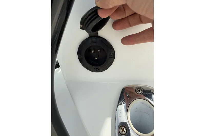 Slide: The Image of 2022 Blazer Bay 2200 boat power outlet and chrome fixture detail. - 20
