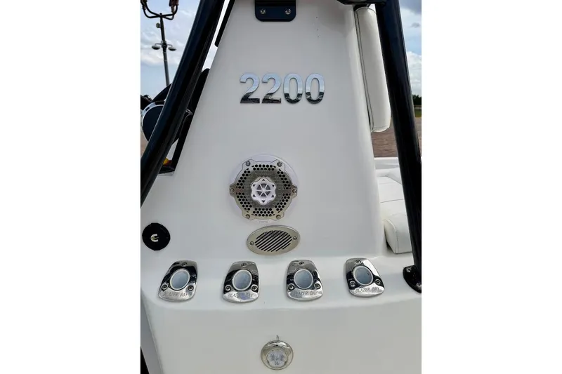 Slide: The Image of 2022 Blazer Bay 2200 boat console with controls and speaker. - 21