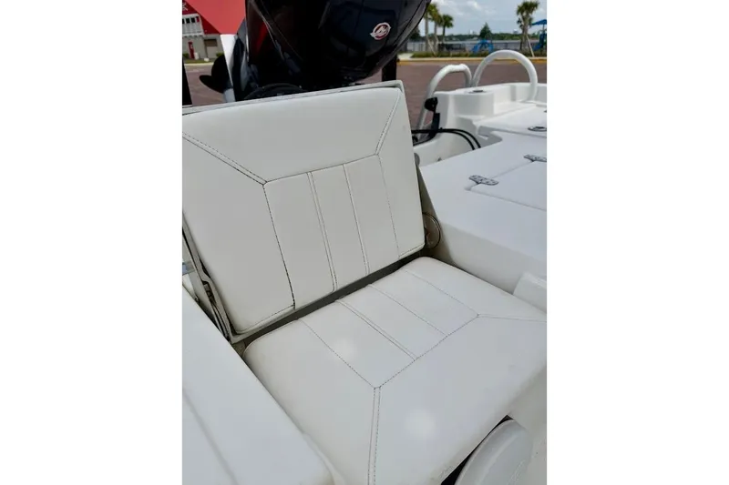 Slide: The Image of White seat on 2022 Blazer Bay 2200 boat, featuring sleek design and stitching. - 22