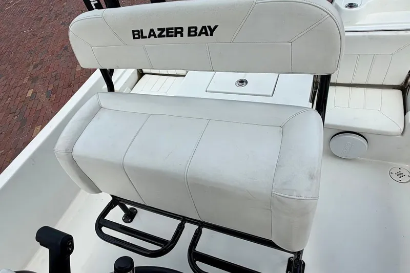 Slide: The Image of White seating on a 2022 Blazer Bay 2200 boat, featuring sleek design and comfortable upholstery. - 25