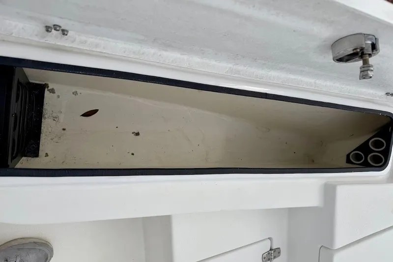 Slide: The Image of Open storage compartment on a 2022 Blazer Bay 2200 boat, showing interior details. - 28