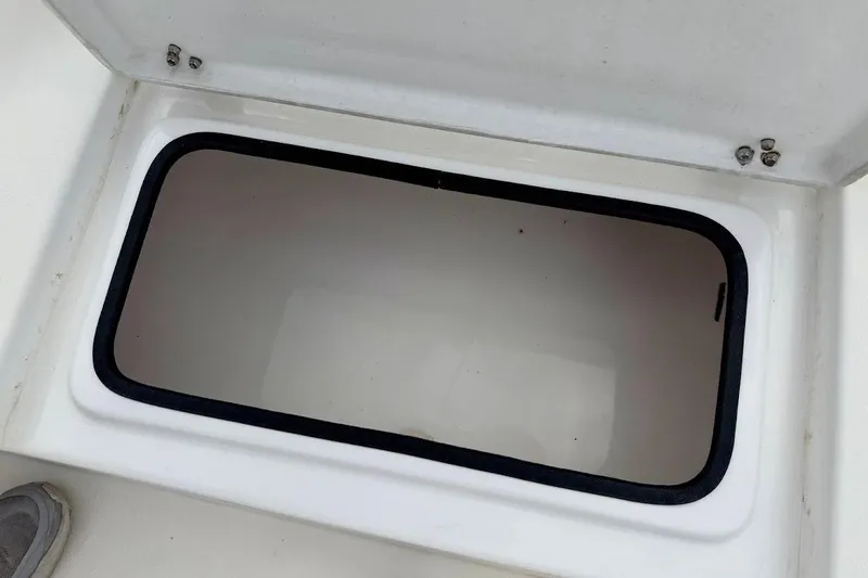 Slide: The Image of Open storage compartment on a 2022 Blazer Bay 2200 boat. - 29