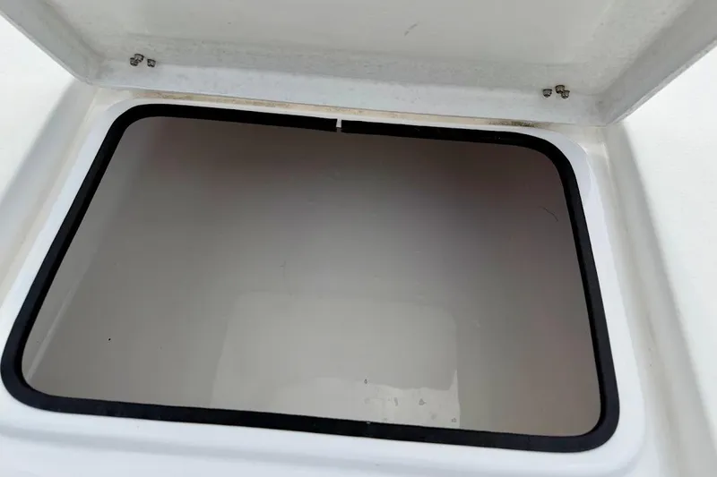 Slide: The Image of Open storage compartment on a 2022 Blazer Bay 2200 boat. - 30