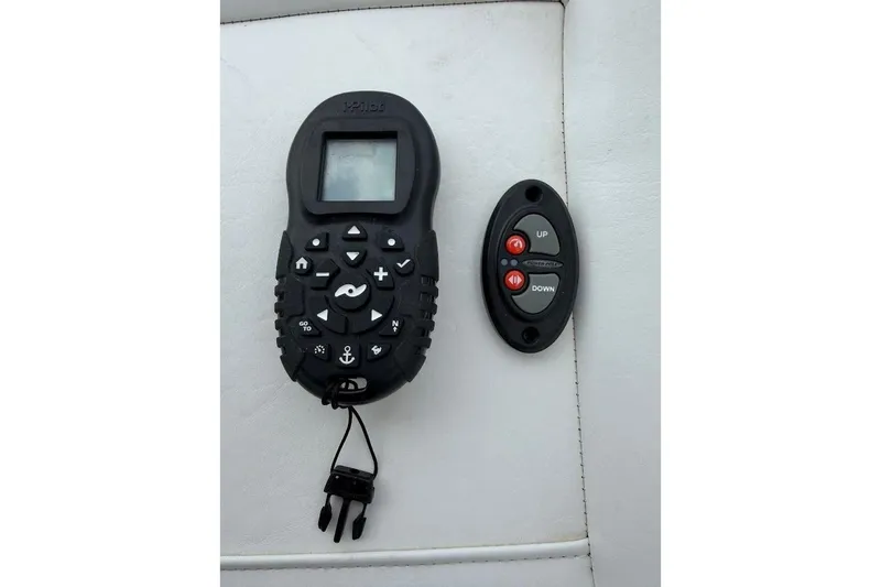 Slide: The Image of Remote controls on a Blazer Bay 2200 boat, 2022 model, on white upholstery. - 32