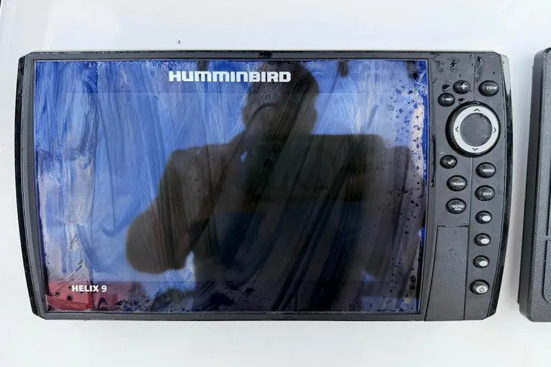 Slide: The Image of Humminbird Helix 9 fish finder on a 2022 Blazer Bay 2200 boat dashboard. - 34