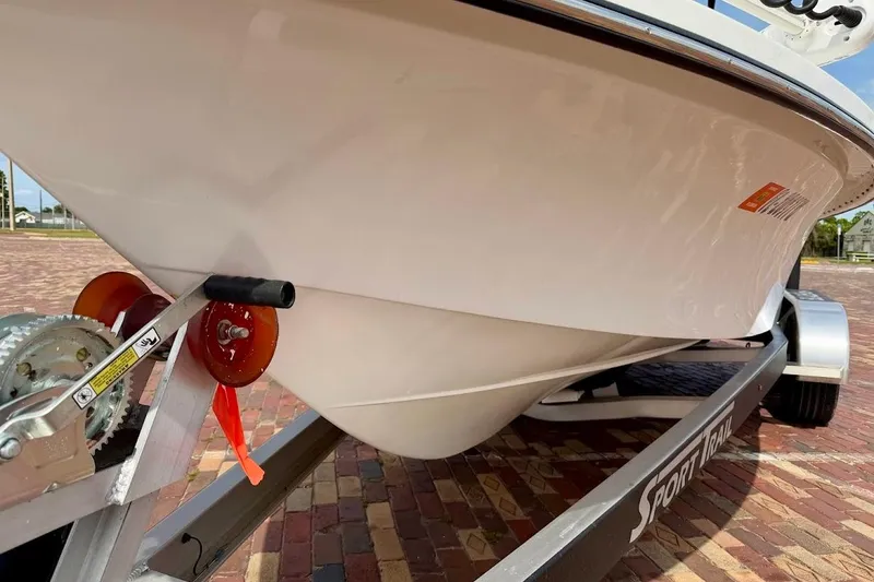 Slide: The Image of 2022 Blazer Bay 2200 boat on Sport Trail trailer, close-up view. - 7