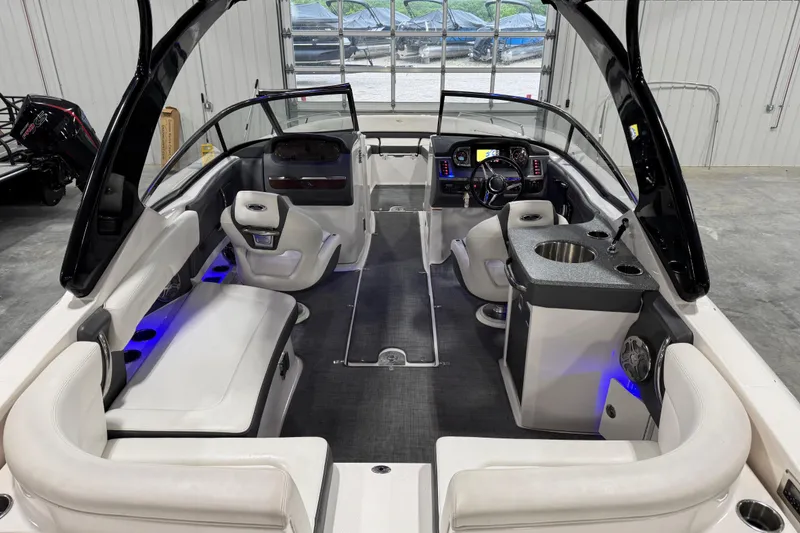 Slide: The Image of 2014 Chaparral 277 SSX boat interior with luxurious seating and modern dashboard. - 11