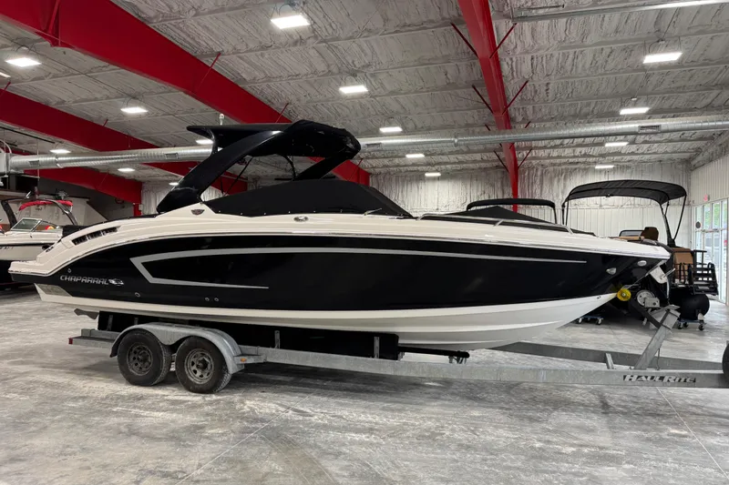 Slide: The Image of 2014 Chaparral 277 SSX boat on trailer in indoor showroom. - 15