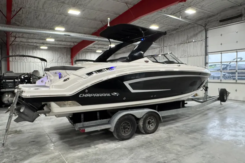 Slide: The Image of 2014 Chaparral 277 SSX boat on trailer in indoor storage facility. - 4