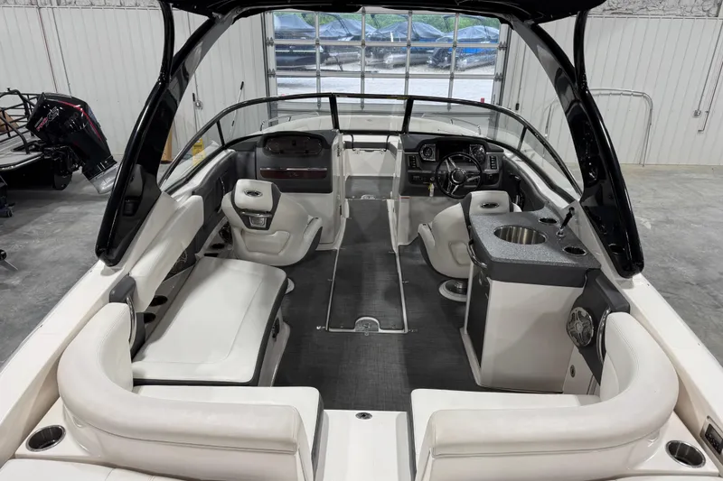Slide: The Image of Interior of a 2014 Chaparral 277 SSX boat with seating and helm. - 5