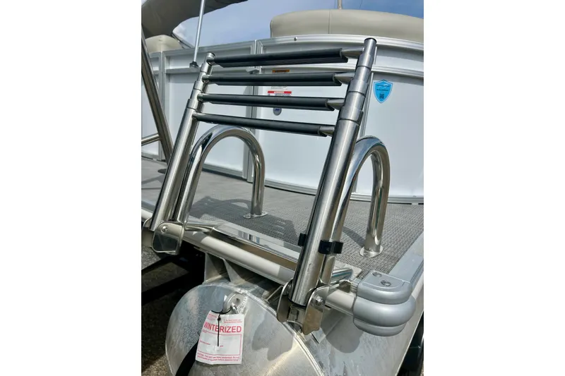 Slide: The Image of Stainless steel ladder on 2023 Sun Chaser Geneva boat, featuring a winterized tag. - 11