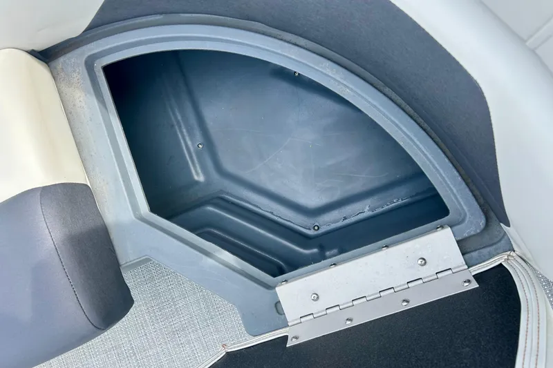Slide: The Image of Storage compartment in 2023 Sun Chaser Geneva boat, featuring a hinged lid and spacious interior. - 28